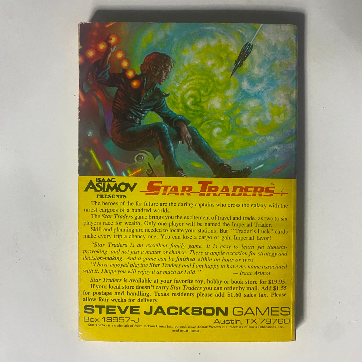 Back cover of Isaac Asimov's Star Traders game featuring vibrant artwork and description of the game, emphasizing its family-friendly nature and strategic play related to space trading.