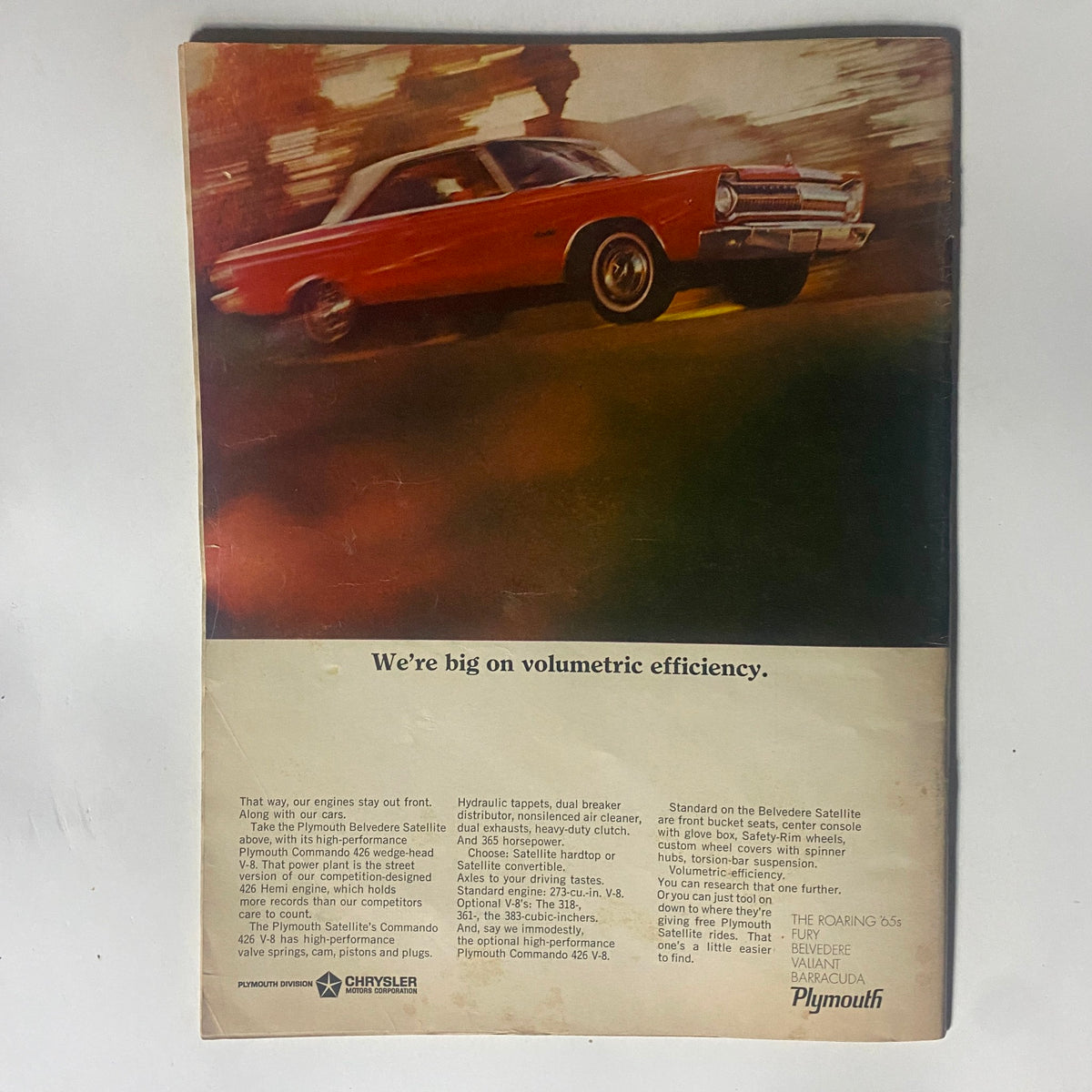 Back cover of VTG Motor Trend Magazine October 1965, featuring a promotional advertisement for the Plymouth Belvedere Satellite emphasizing volumetric efficiency.