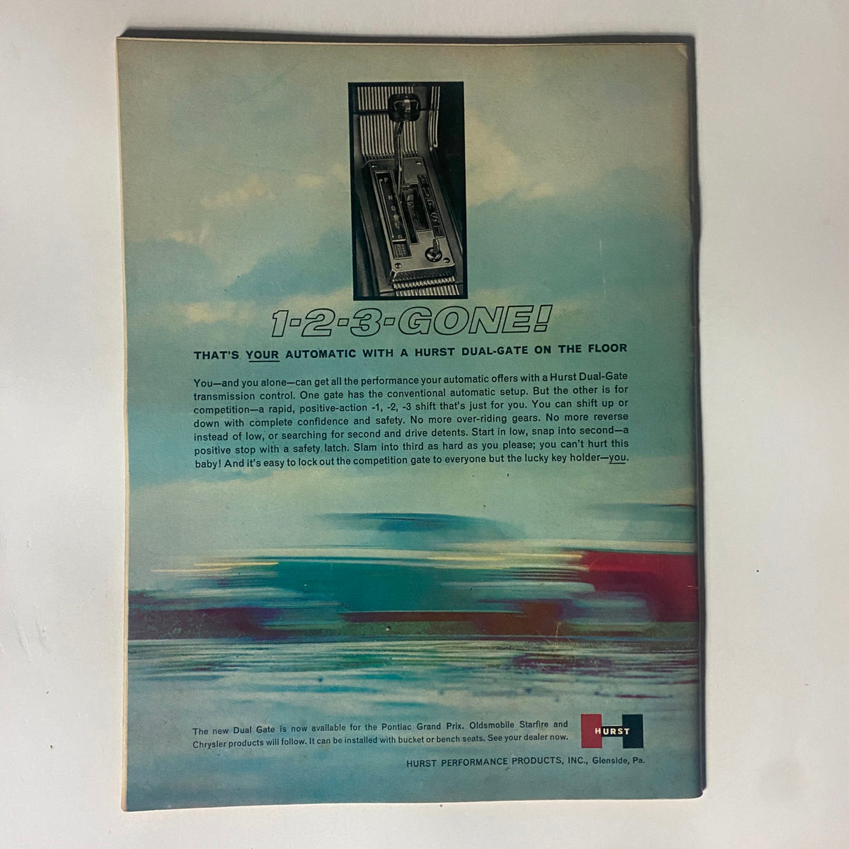 Back cover of VTG Motor Trend Magazine December 1963 featuring an advertisement for Hurst Dual-Gate automatic transmission control, emphasizing performance and ease of use.
