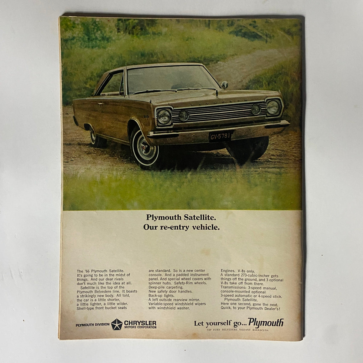Plymouth Satellite advertisement from the Motor Trend Magazine December 1965 issue, highlighting features of the vehicle with a vintage aesthetic.