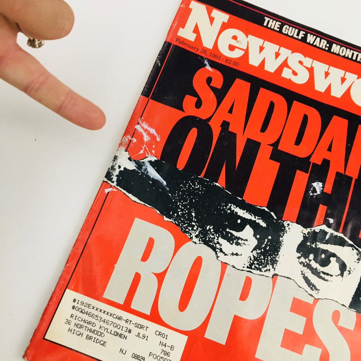 Close-up of the cover of Newsweek Magazine February 25, 1991, highlighting the title 'Saddam on the Ropes' and featuring an address label.