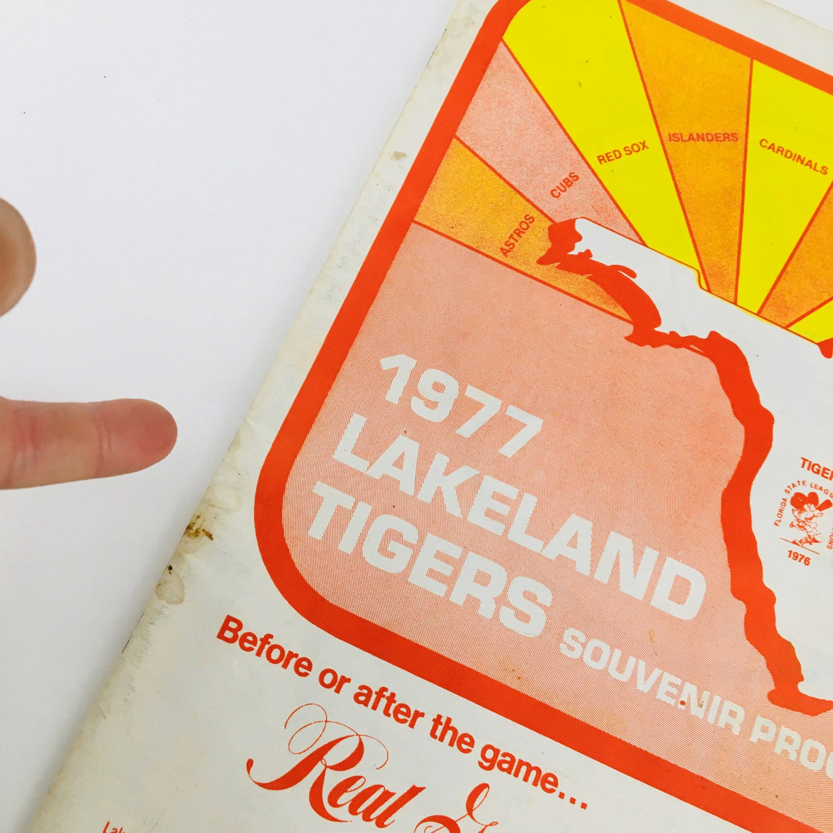 Cover of the 1977 MLB Baseball Lakeland Flying Souvenir Program featuring a prominent design and the text '1977 LAKELAND TIGERS SOUVENIR PROGRAM'.