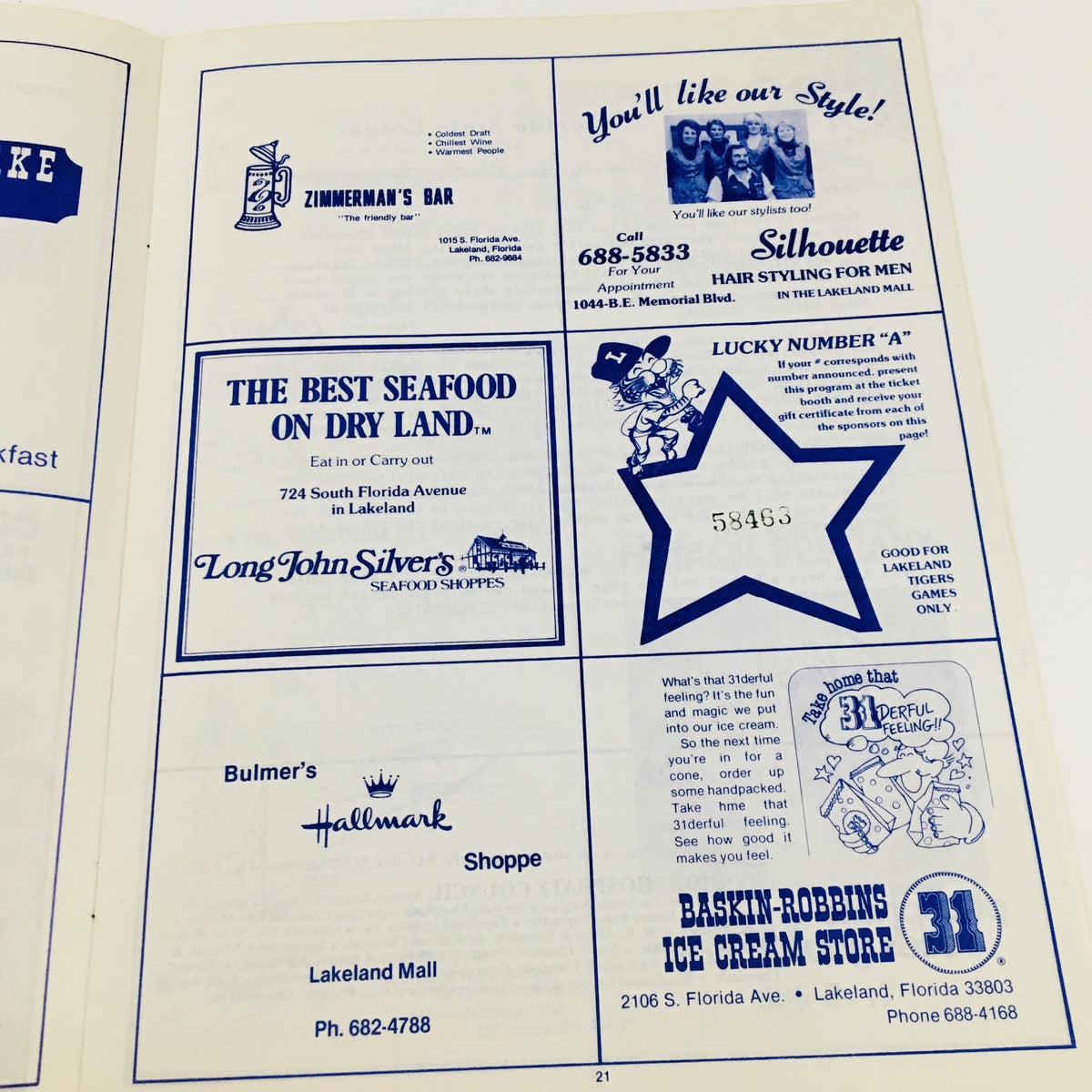 Advertisement page from the 1977 MLB Baseball Lakeland Flying Souvenir Program featuring local businesses, including Long John Silver's and Baskin-Robbins.