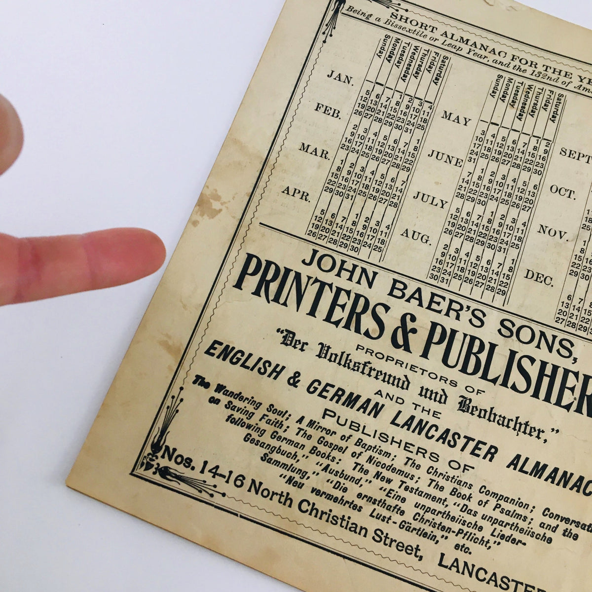 Detailed view of the Agricultural Almanac for the Year of Our Lord 1908, focusing on a calendar page and the printing details from John Baer's Sons, Printers & Publishers. Ideal for those interested in early 20th century agricultural practices.