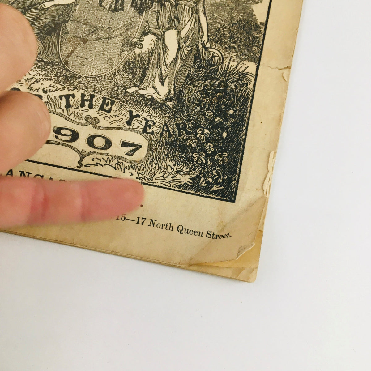 Detail of the cover of the Agricultural Almanac For The Year Of Our Lord 1907, highlighting the publication details in Lancaster, PA.