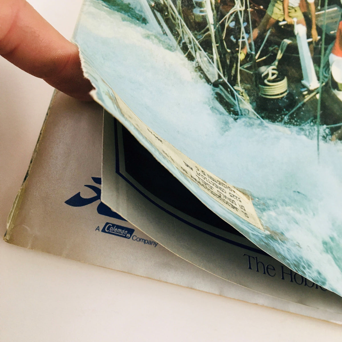 Image showing the interior of Sail Magazine January 1980, with a focus on the damaged edge, featuring content about sailing advancements and surfing culture.