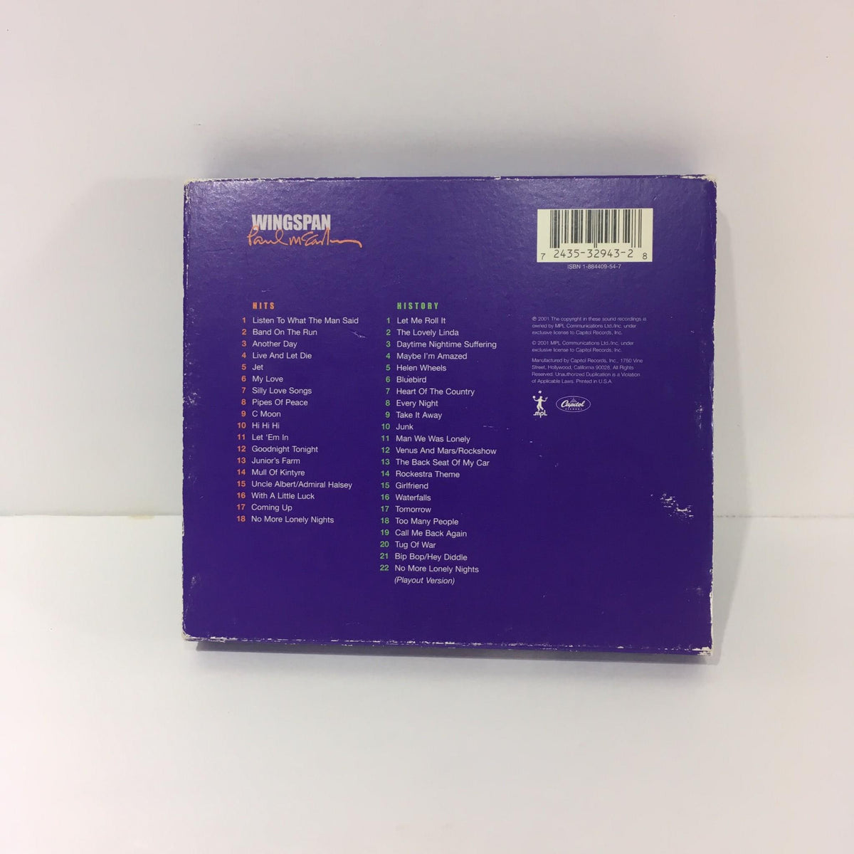 Back cover of Paul McCartney Wingspan Hits and History Audio CD listing the tracks and credits.