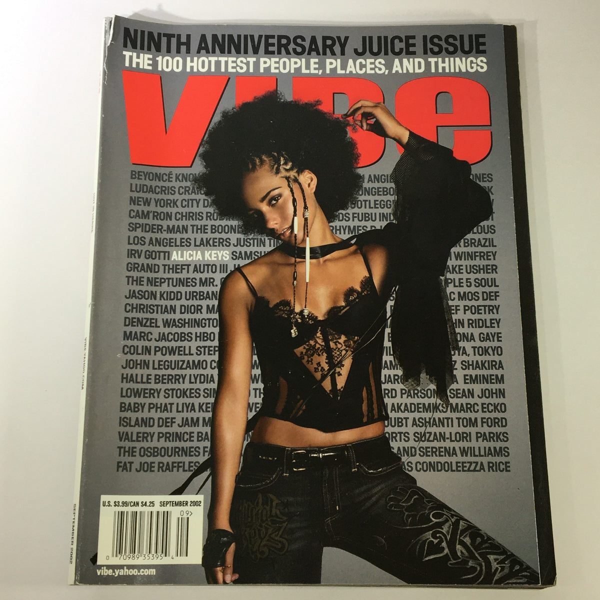 Vibe Magazine September 2002 cover featuring Alicia Keys, showcasing a vintage design with bold typography and vivid colors, highlighting significant figures in music.