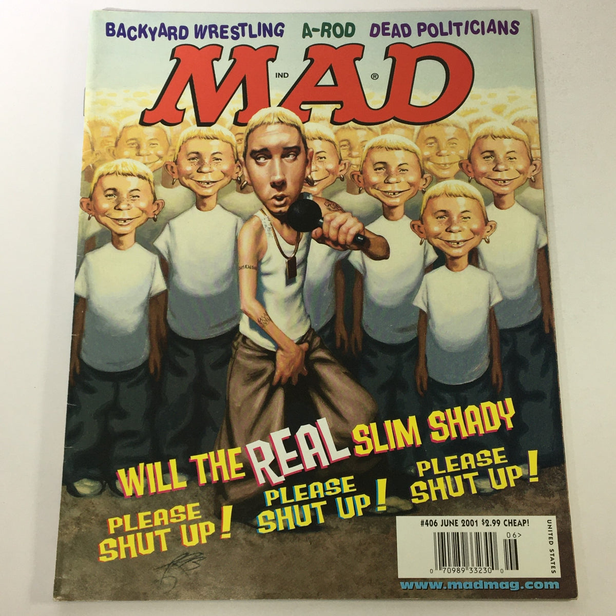 Cover of Mad #406 from June 2001 featuring Slim Shady (Eminem) with illustrations of backyard wrestling and dead politicians, highlighting the magazine's satire and pop culture commentary.