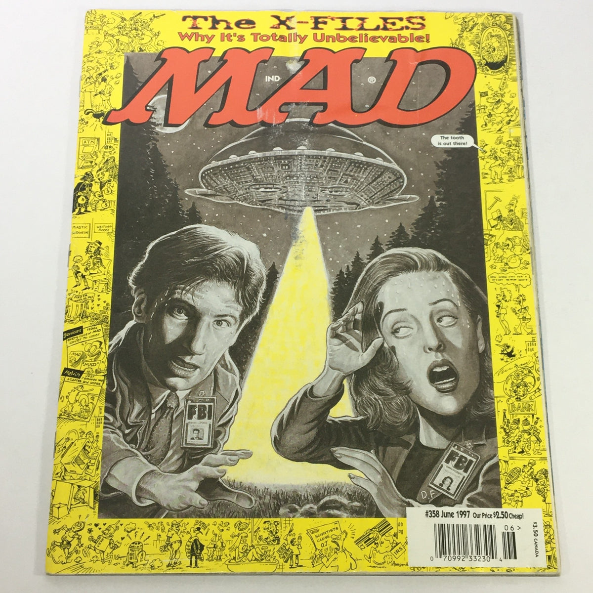 Cover of Mad #358 June 1997 featuring Gillian Anderson and David Duchovny from The X-Files Series, showcasing a humorous depiction of an alien spaceship with a spotlight effect.