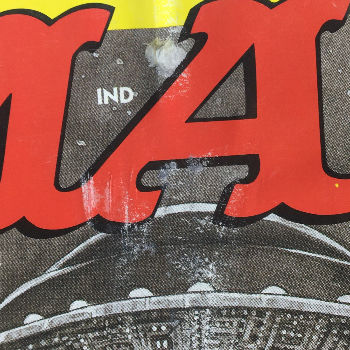 Close-up of the title on the cover of Mad #358 June 1997, showing detail on the graphic design and wear, featuring elements related to The X-Files Series.