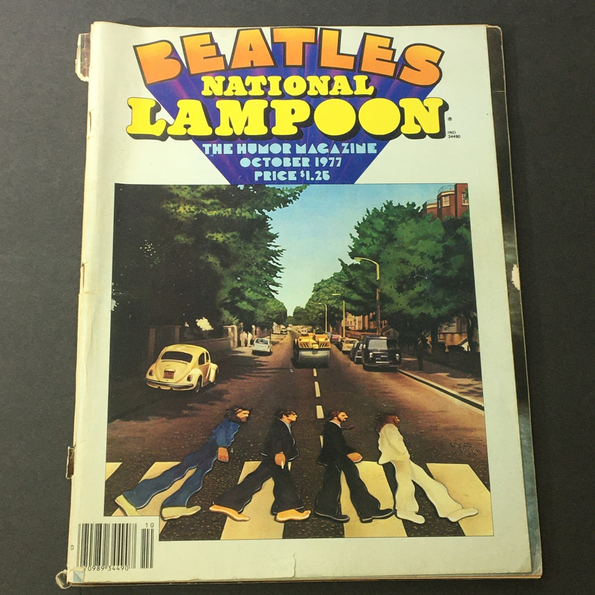 The National Lampoon Humor Magazine October 1977 Edition featuring The Beatles with a colorful cover designed in vintage style, showcasing iconic imagery inspired by the band on its front.