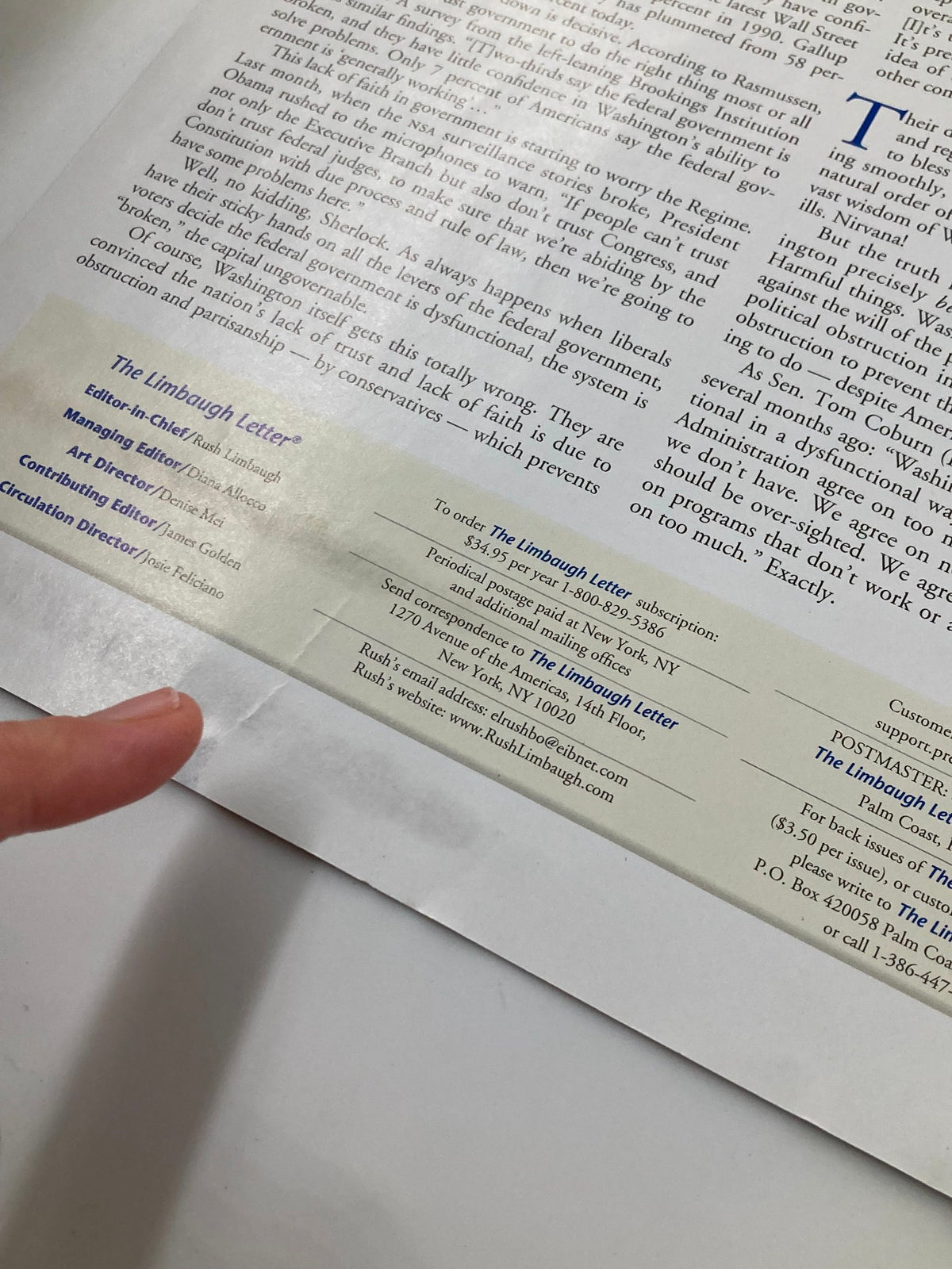 Close-up image of the Rush Limbaugh Letter Newsletter Magazine from August 2013, showcasing the subscription details and contact information. This collectible issue is part of the theme 'We Don't Trust Washington' and reflects on political commentary.