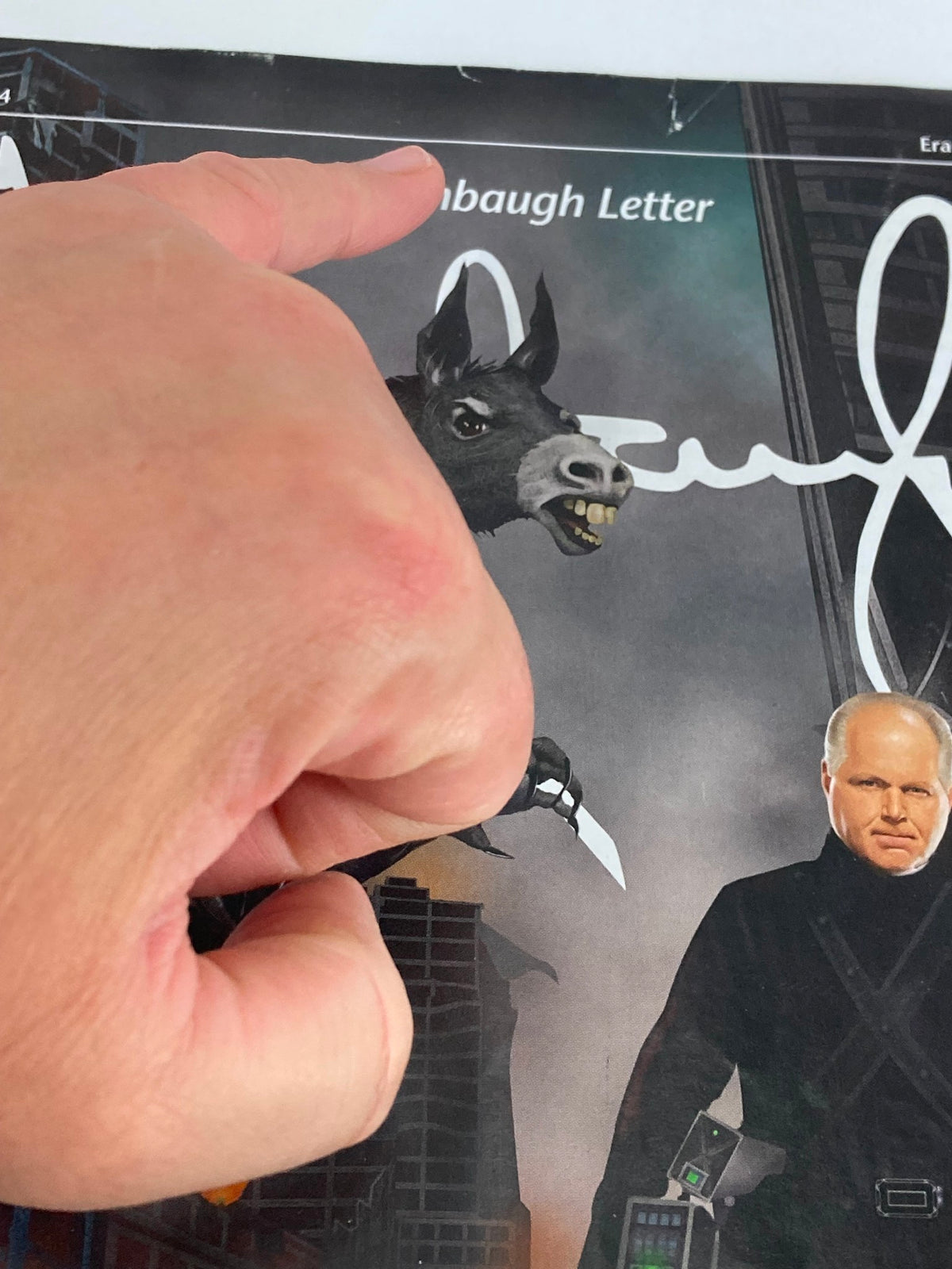 Close-up view of the Rush Limbaugh Letter Newsletter Magazine June 2014 cover highlighting the detailed illustration of a character with a weapon and a donkey.