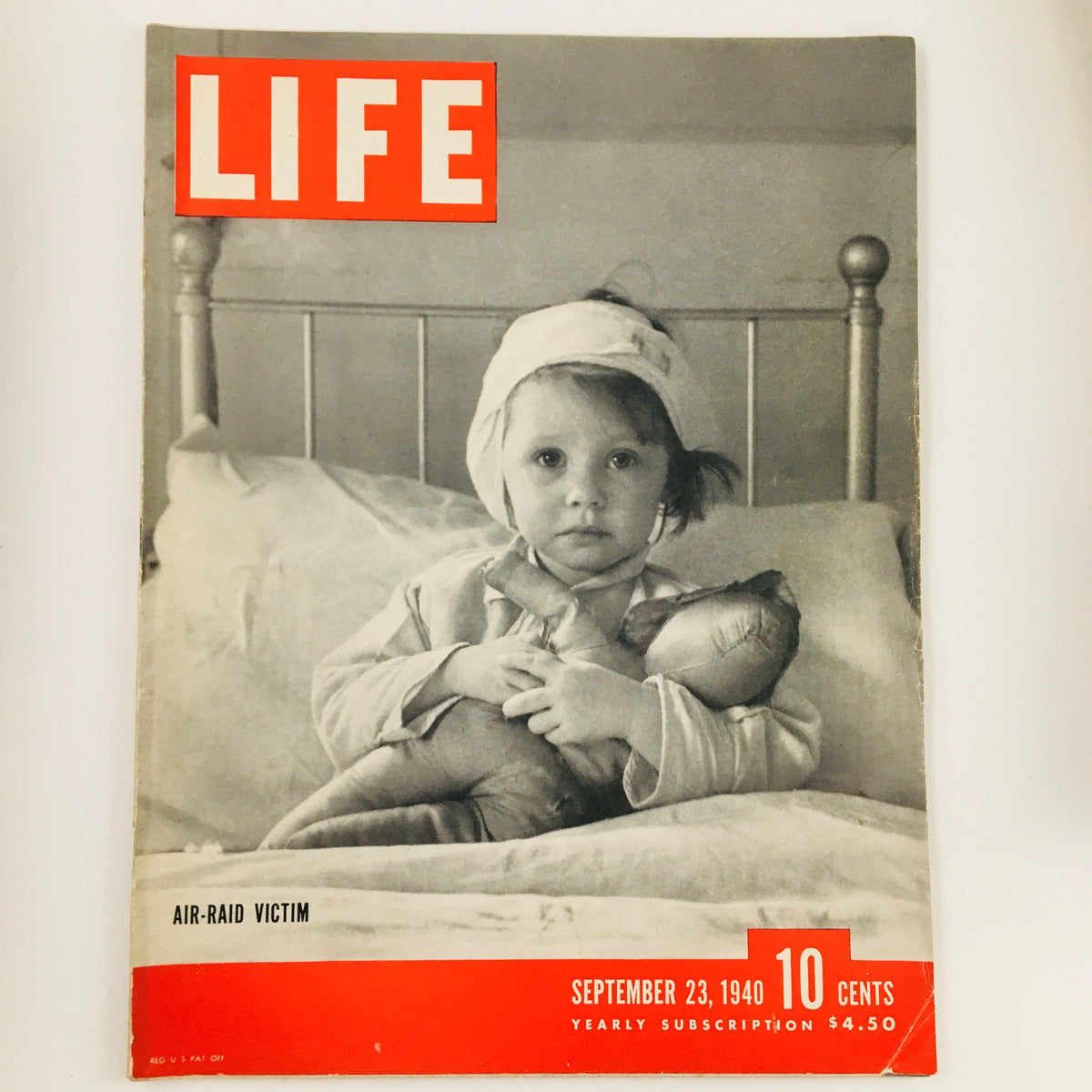 Cover of VTG Life Magazine, September 23, 1940, featuring a poignant photo of an air-raid victim, showcasing the emotional impact of wartime experiences.