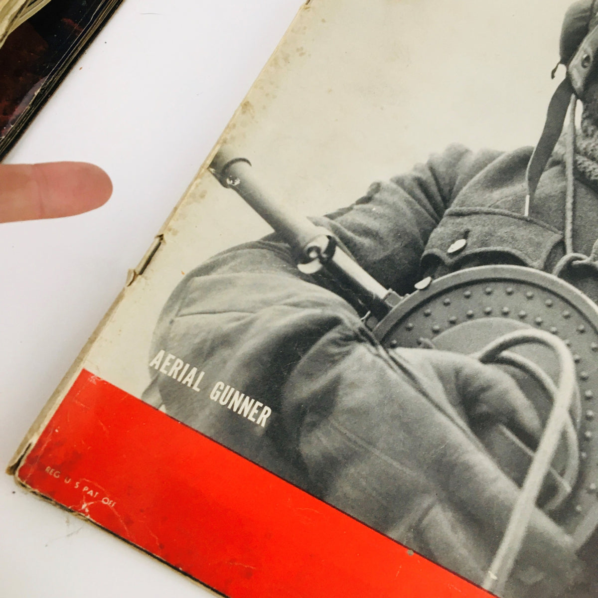 Close-up view of the cover of VTG Life Magazine May 6, 1940, highlighting the aerial gunner image and the magazine's title with a red border and vintage details.
