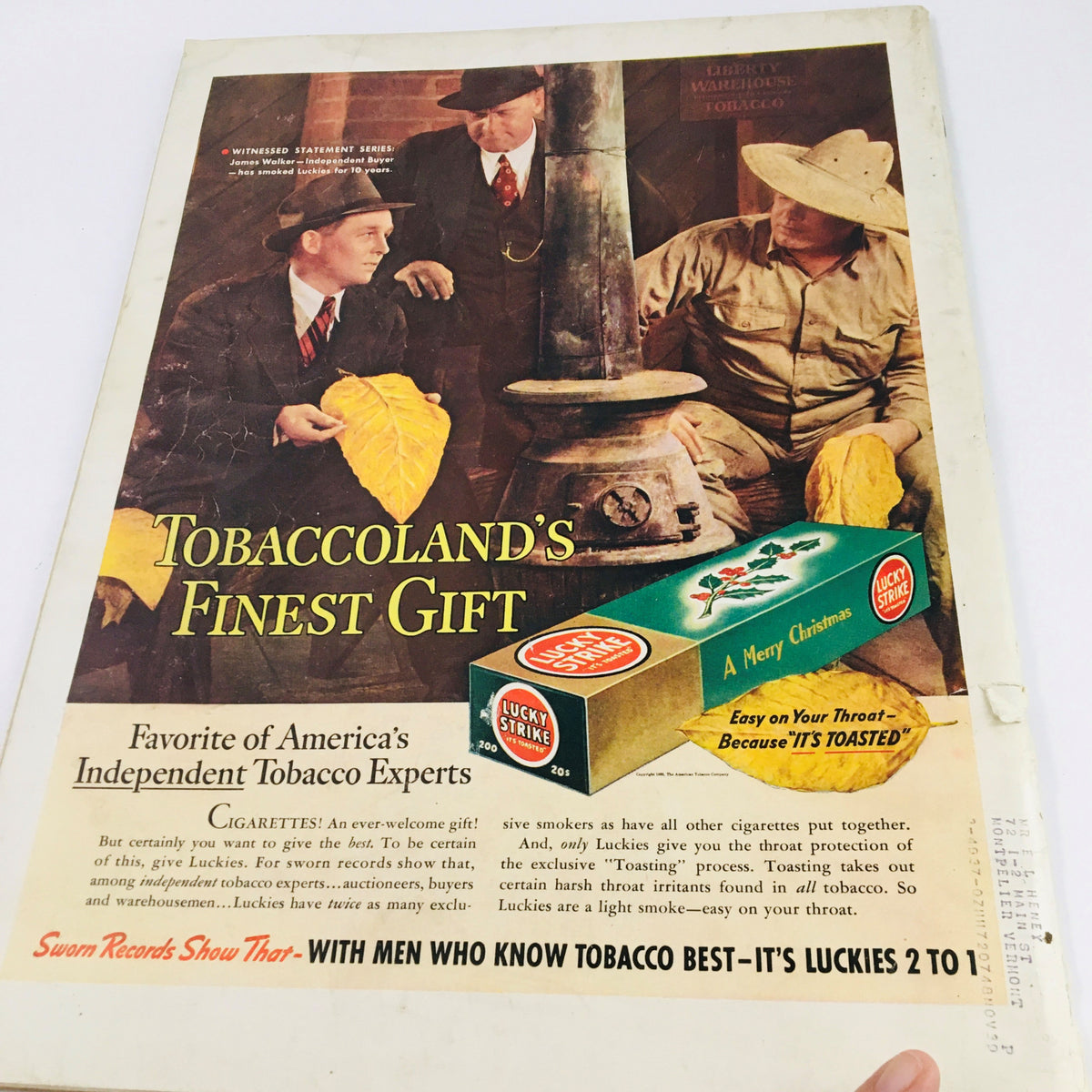 VTG Life Magazine December 12 1938 Photograph of a Labrador Retriever featuring an advertisement for Lucky Strike cigarettes. The image depicts two men discussing tobacco leaves in a vintage setting.