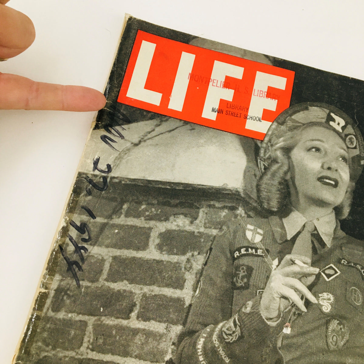Close-up of the cover of VTG Life Magazine November 27, 1944 showcasing Gertrude Lawrence with library markings, emphasizing its vintage authenticity.
