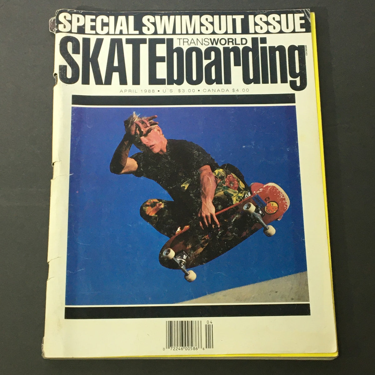 Cover of Transworld Skateboarding Magazine April 1988 - Special Swimsuit Issue featuring a skateboarder performing a trick against a blue background.