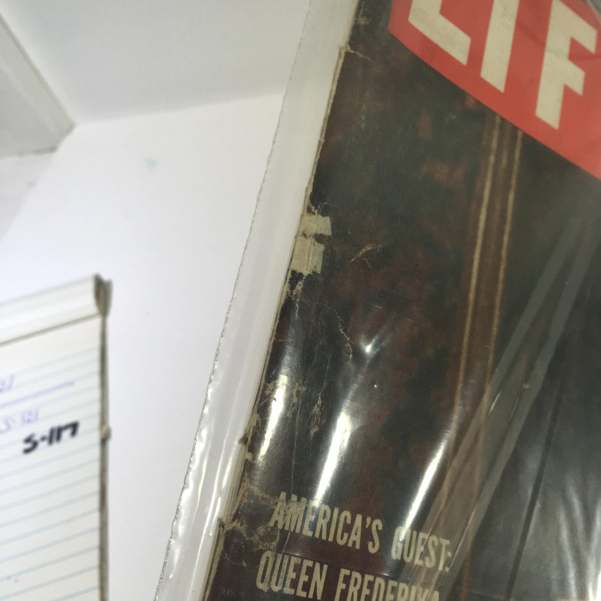 Close-up detail of VTG Life Magazine from November 16, 1953, showcasing 'America's Guest Queen Frederika Of Greece' with visible wear and protective cover.