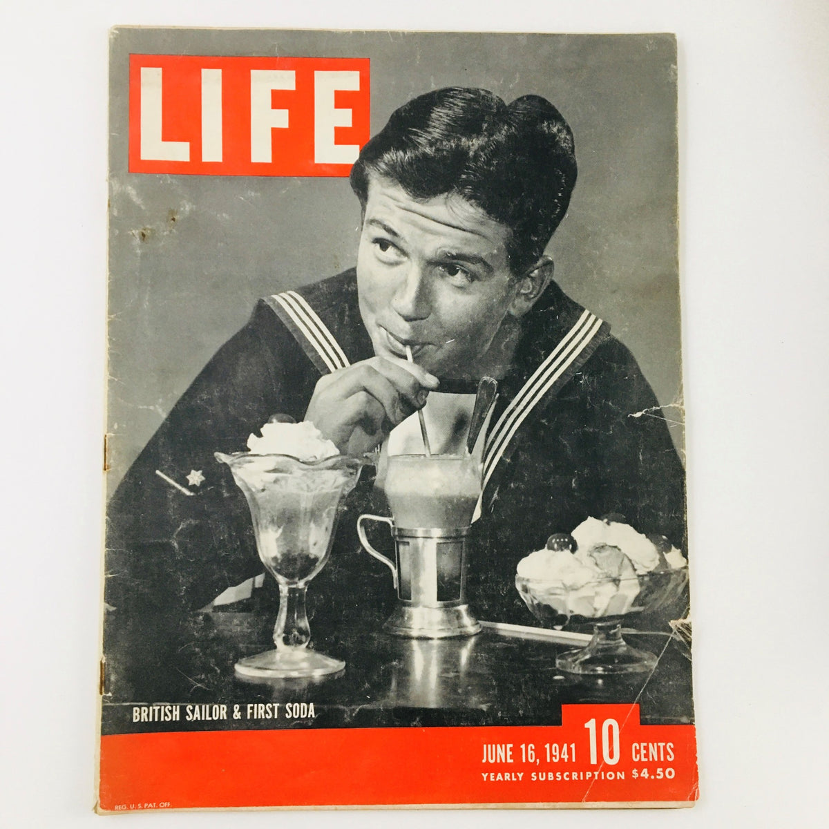 Vintage Life Magazine featuring a British sailor enjoying a soda, dated June 16, 1941. The magazine cover showcases a nostalgic moment from World War II, emphasizing its historical significance.