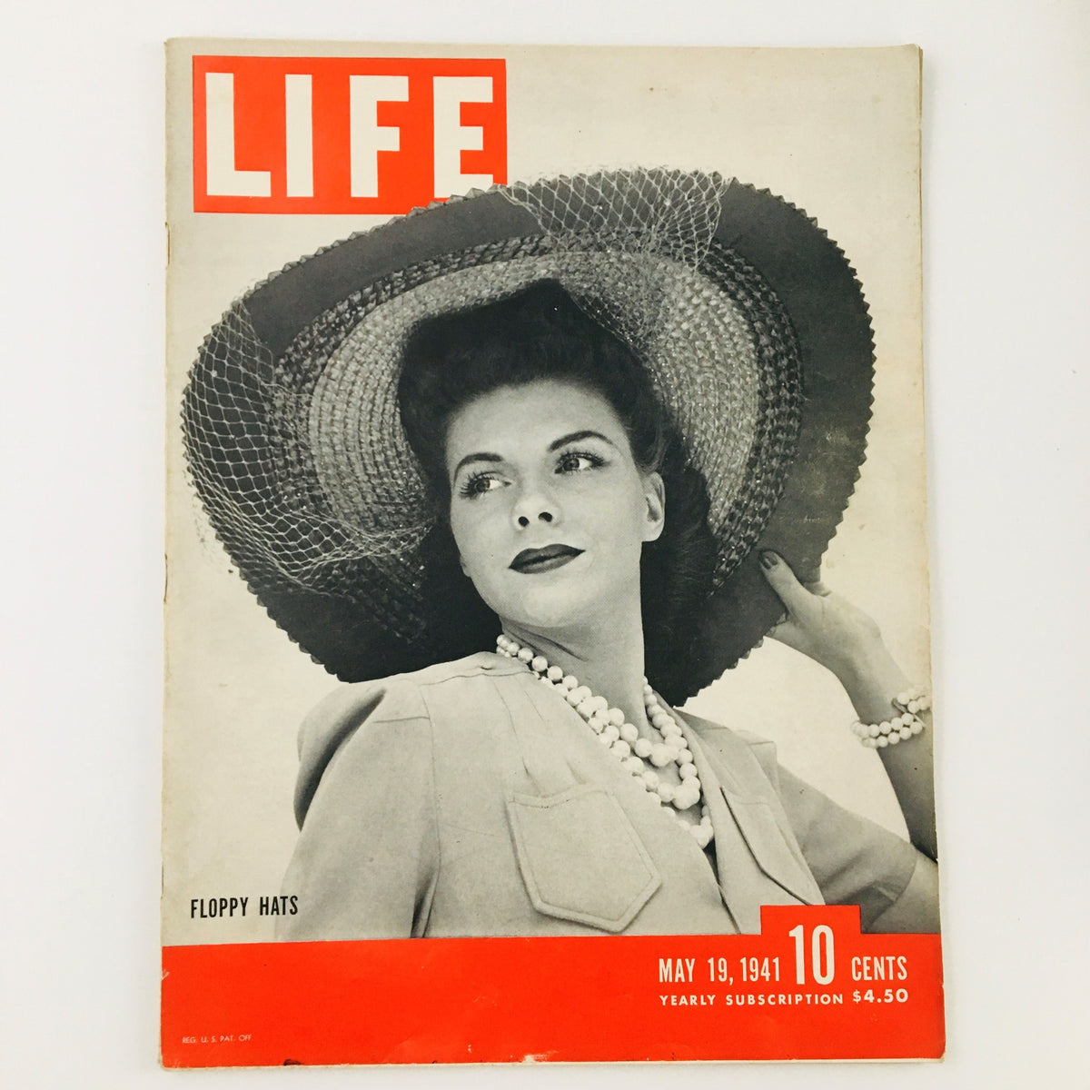 Cover of VTG Life Magazine May 19 1941 featuring a model wearing a large floppy hat, elegant necklace, and stylish attire, highlighting the fashion trends of the era. Includes the title 'LIFE' and mentions 'Floppy Hats'.