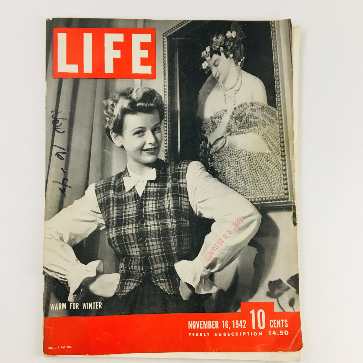 Life Magazine November 16, 1942 vintage cover showcasing a woman in a plaid outfit, emphasizing warmth for winter during World War II.