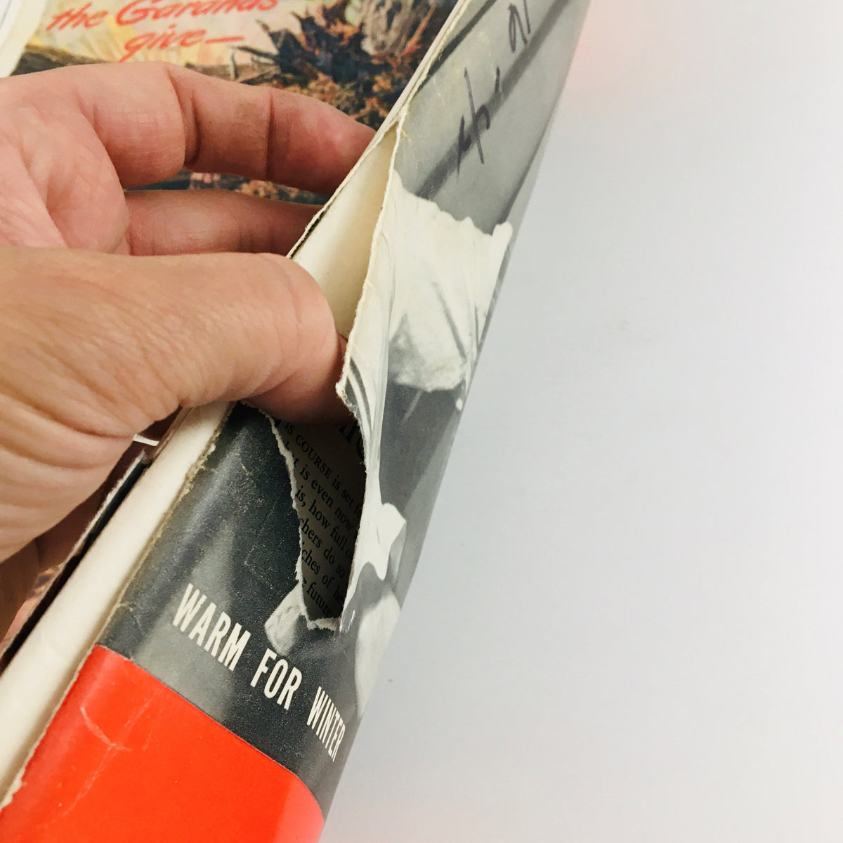 Detail of the Life Magazine November 16, 1942 showcasing the magazine's edge wear and a tear, emphasizing its authenticity and vintage condition.