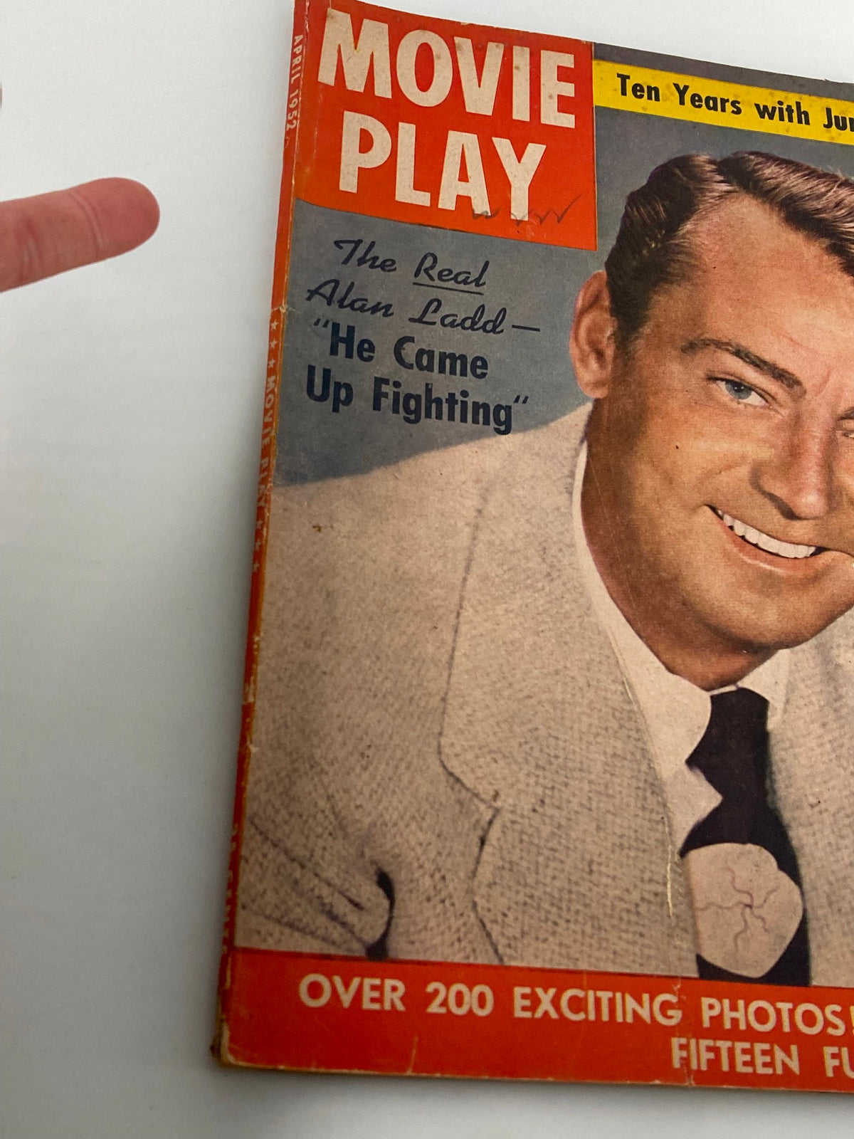 Close-up of the VTG Movie Play Magazine April 1952 cover highlighting Alan Ladd and promotional text about articles and photos inside.