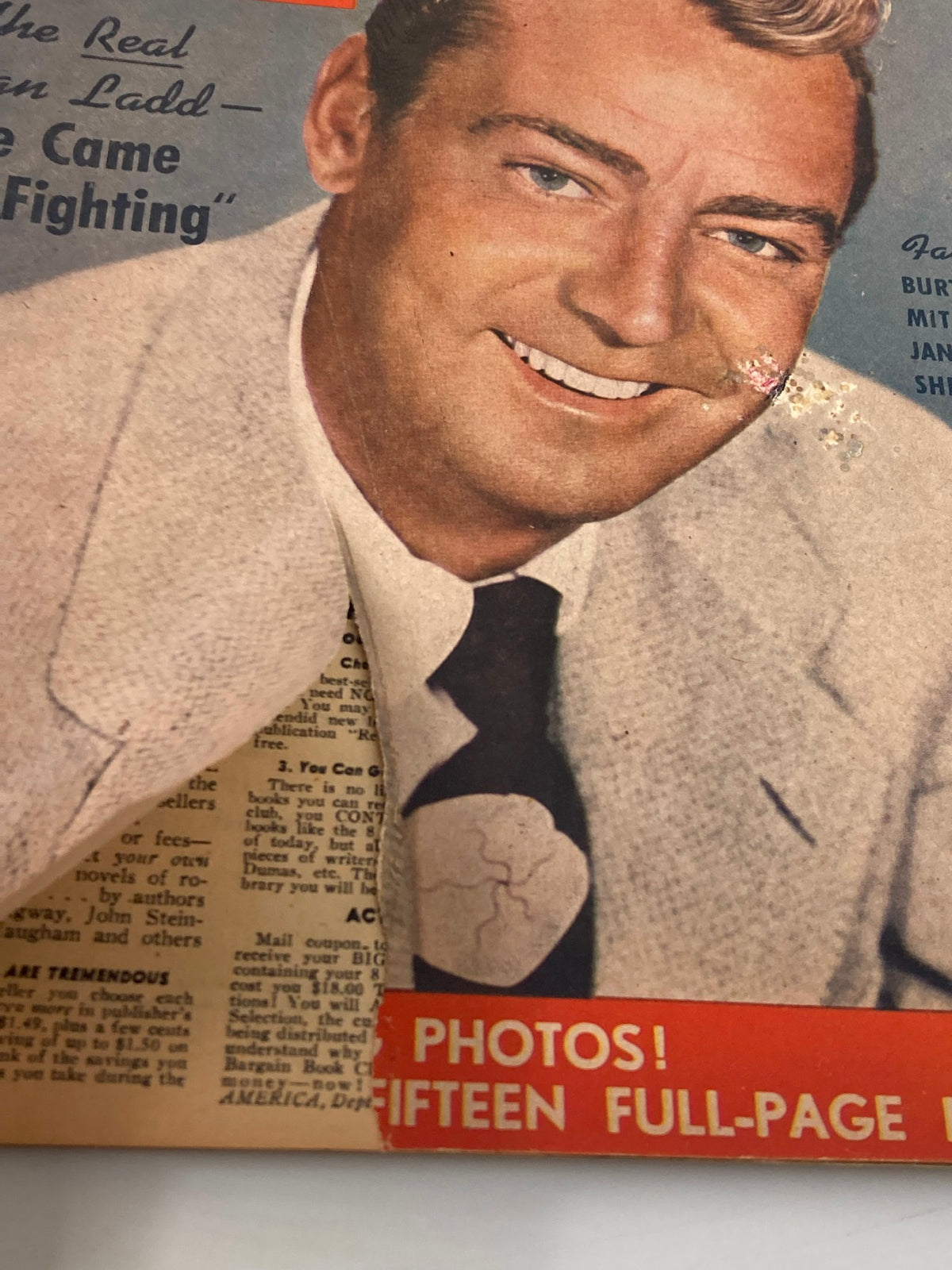 Detailed view of the VTG Movie Play Magazine April 1952 cover, emphasizing Alan Ladd's smiling expression and the magazine's appealing design.