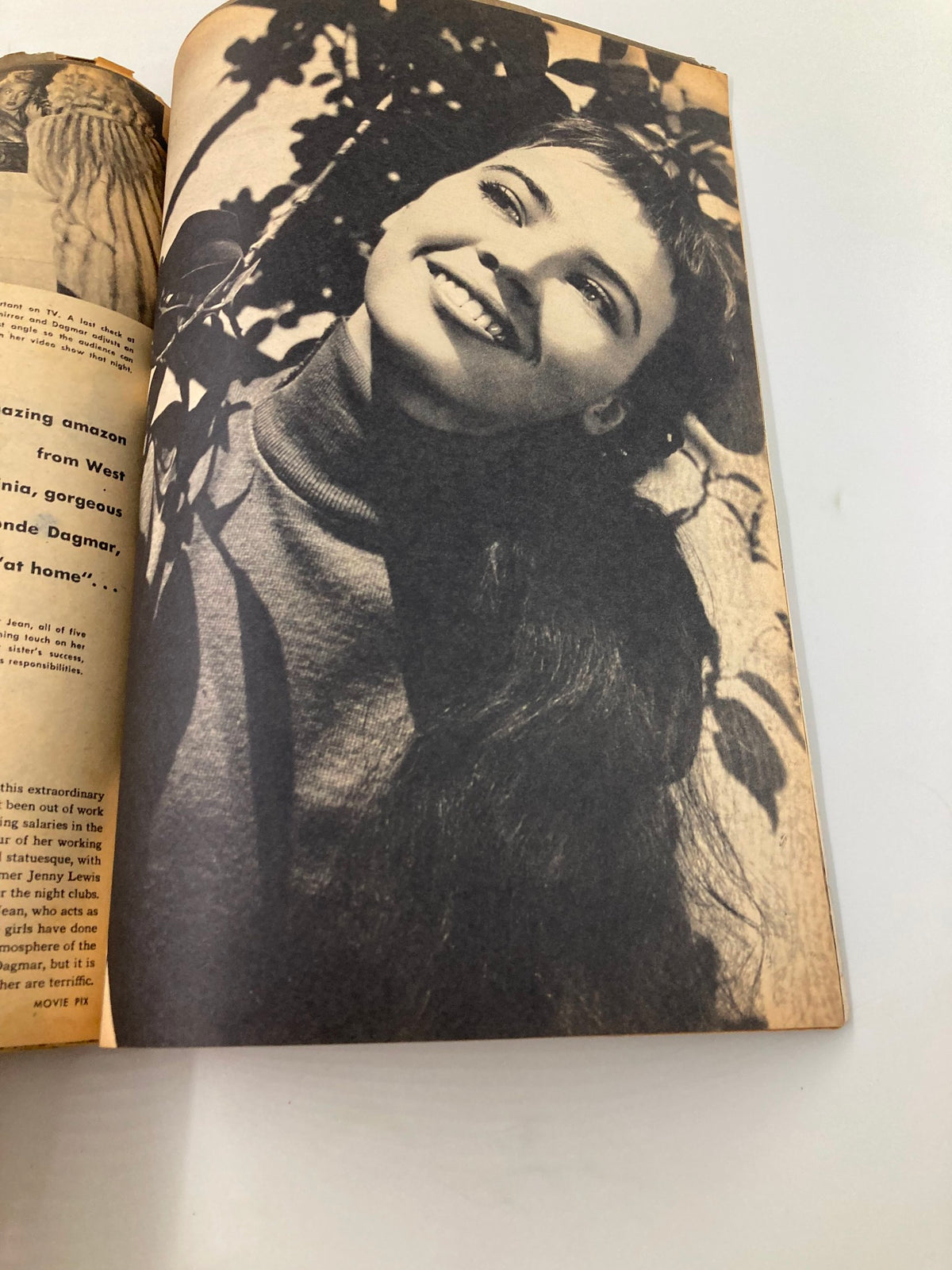 A black and white photograph from the VTG Movie Teen Magazine March 1951, featuring a cheerful young woman against a nature backdrop, highlighting the magazine's focus on teen culture.