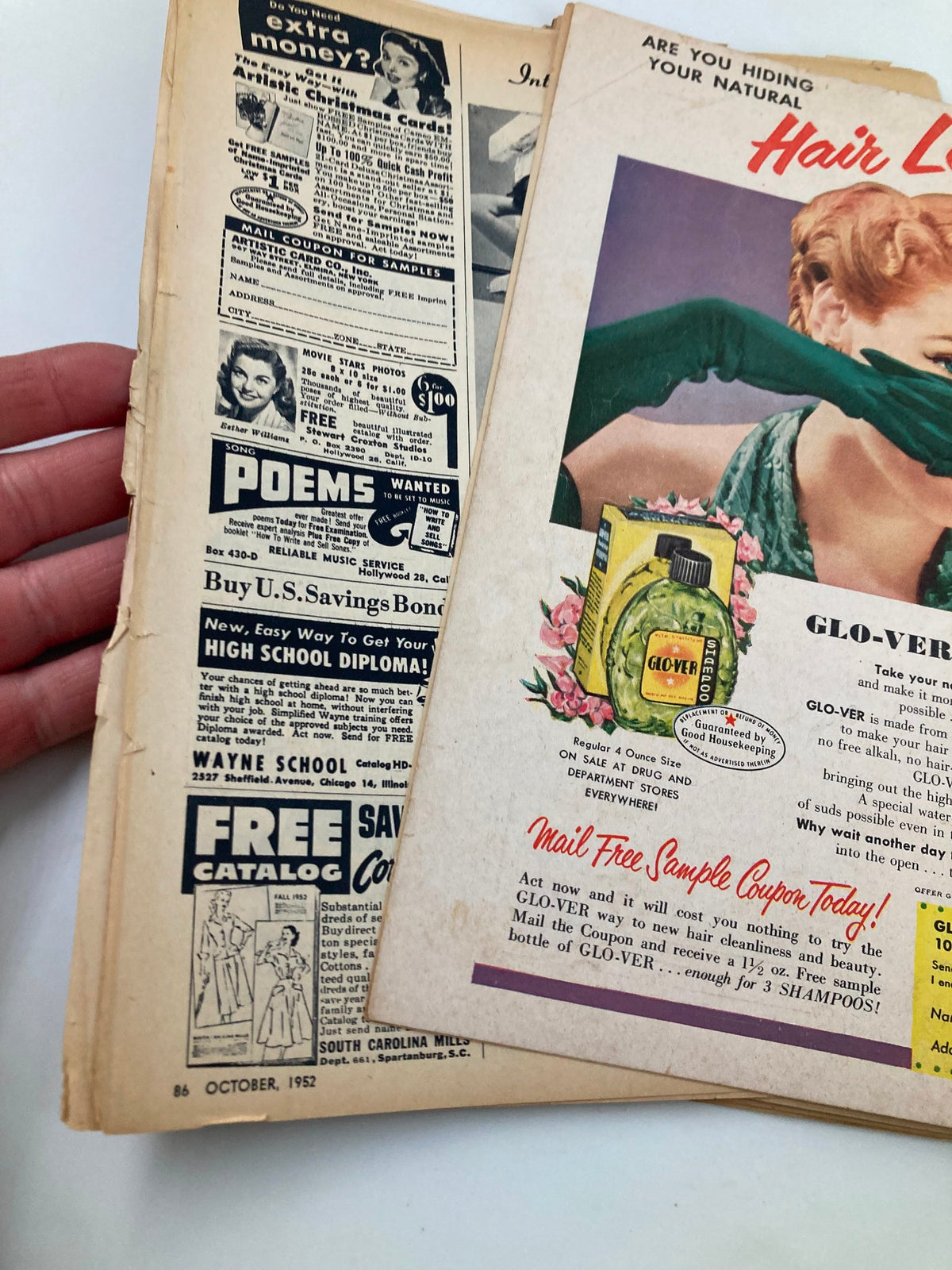 Page from VTG Movie Life Magazine October 1952 displaying various vintage advertisements, including hair care and other products, reflecting classic advertising styles of the era.