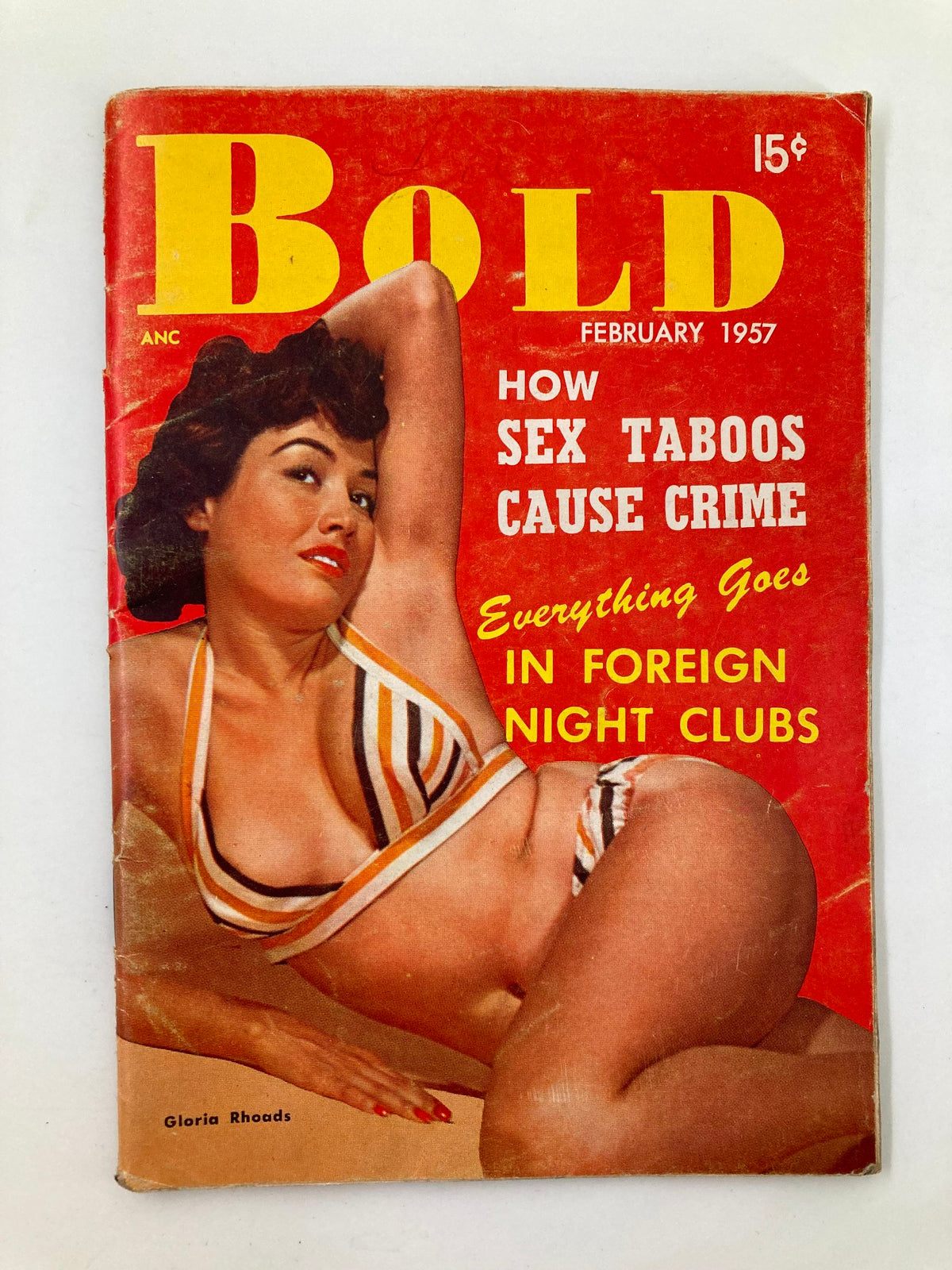 Cover of VTG Bold Mini Magazine February 1957 featuring Gloria Rhoads in a stylish striped bikini, with bold text about foreign night clubs and sex taboos.