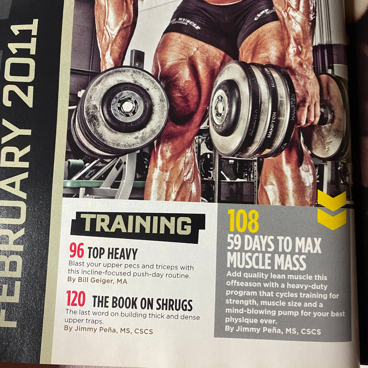 Interior page from MuscleMag International Magazine February 2011, highlighting training article titled 'Top Heavy' and '59 Days to Max Muscle Mass'.