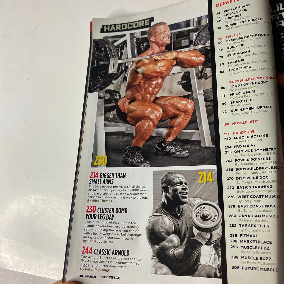 MuscleMag International Magazine March 2011 #346 featuring a muscular athlete performing a squat exercise, highlighting strength training techniques and bodybuilding insights.