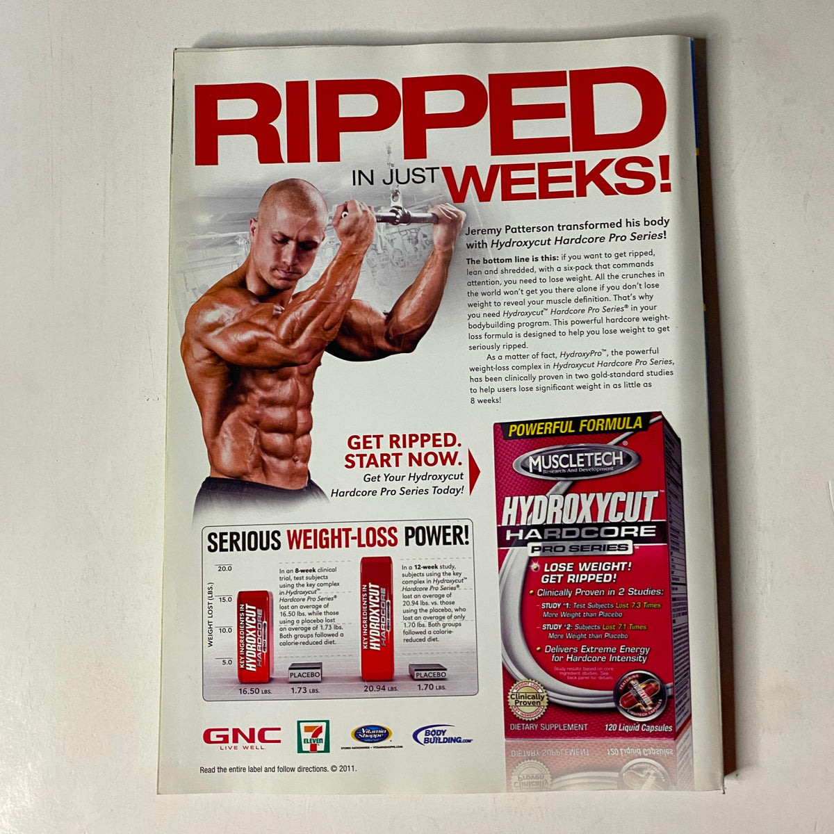 MuscleMag International Magazine December 2011 Michael Liberatore cover featuring a bodybuilder promoting Hydroxycut Hardcore with a weight-loss message, showcasing fitness and bodybuilding insights.