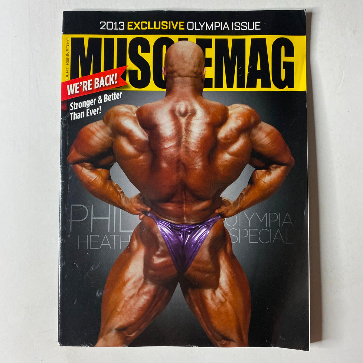Cover of MuscleMag International Magazine November 2013 featuring Phil Heath, Mr. Olympia, showcasing his muscular physique, emphasizing strength and bodybuilding excellence. Title: MuscleMag International Magazine November 2013 Phil Heath No Label VG.