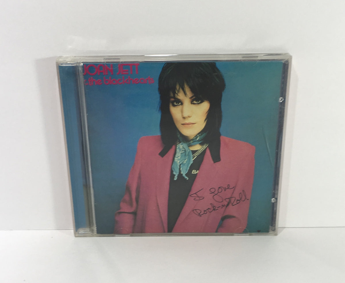 Joan Jett The Blackhearts Audio CD cover featuring Joan Jett in a pink blazer and scarf, showcasing her iconic rock style.