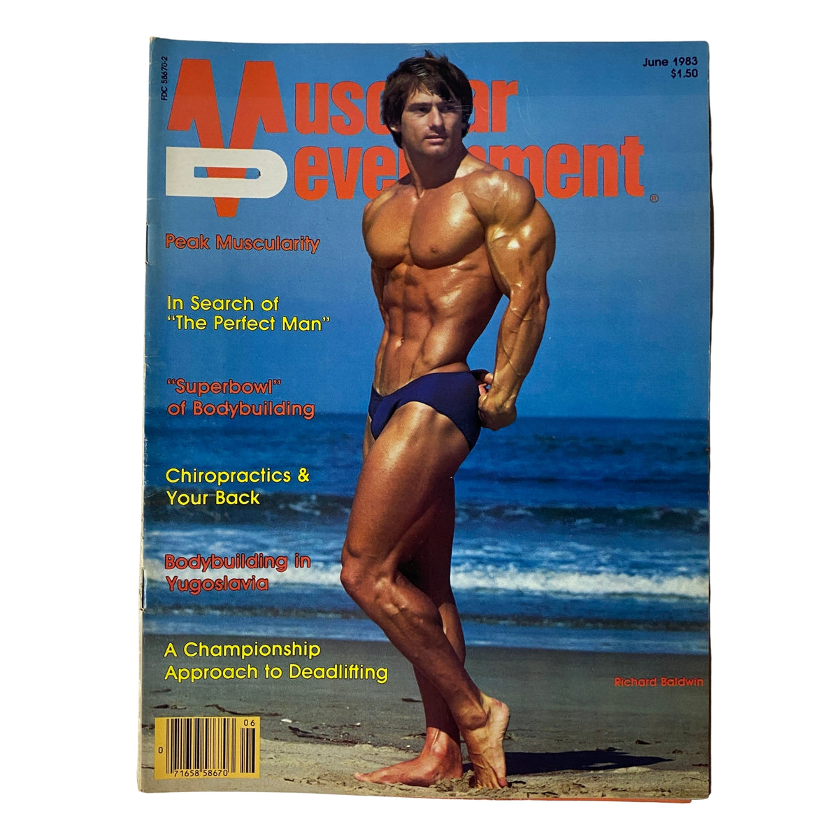 Muscular Development Magazine June 1983 cover featuring Richard Baldwin. A well-defined bodybuilder posing on the beach with a classic physique, emphasizing the magazine's theme of peak muscularity.