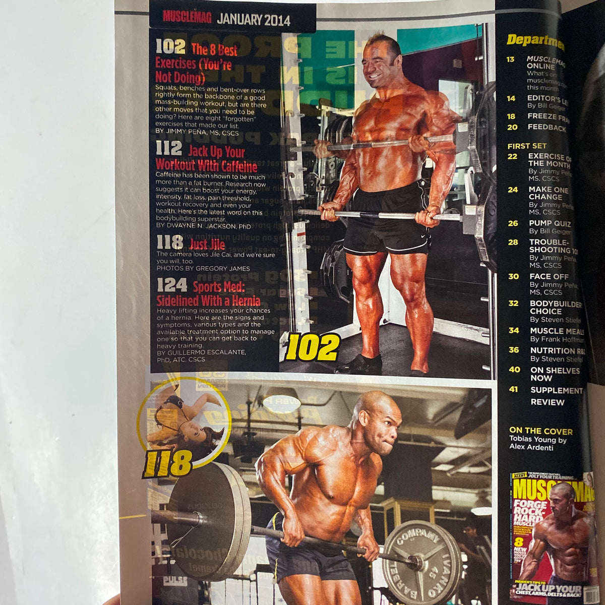 Inside page of MuscleMag International Magazine January 2014 with articles on effective exercises and nutritional advice for bodybuilding enthusiasts.