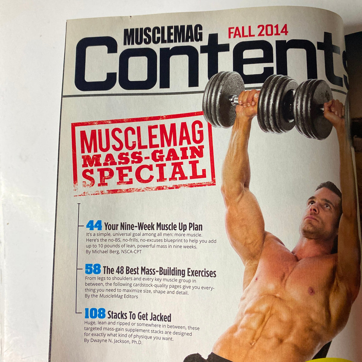 Contents page of MuscleMag International Magazine Fall 2014, featuring a mass-gain special and articles on muscle-building exercises and nutritional strategies.