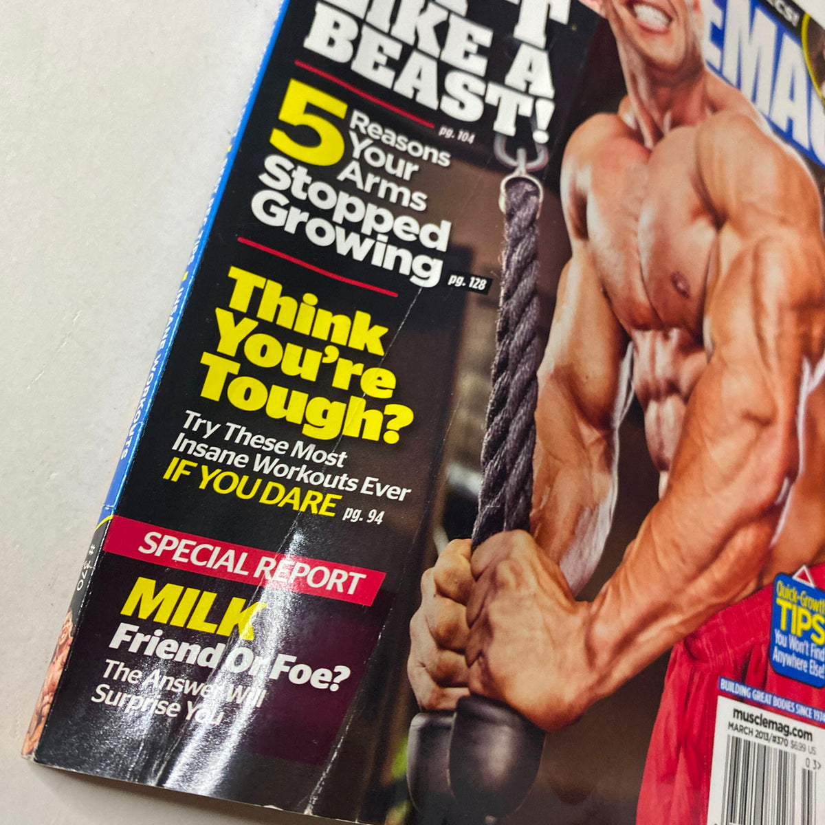 Cover of MuscleMag International Magazine March 2013 #370 featuring a fitness athlete gripping a cable handle and bold text highlighting workout insights and special reports.
