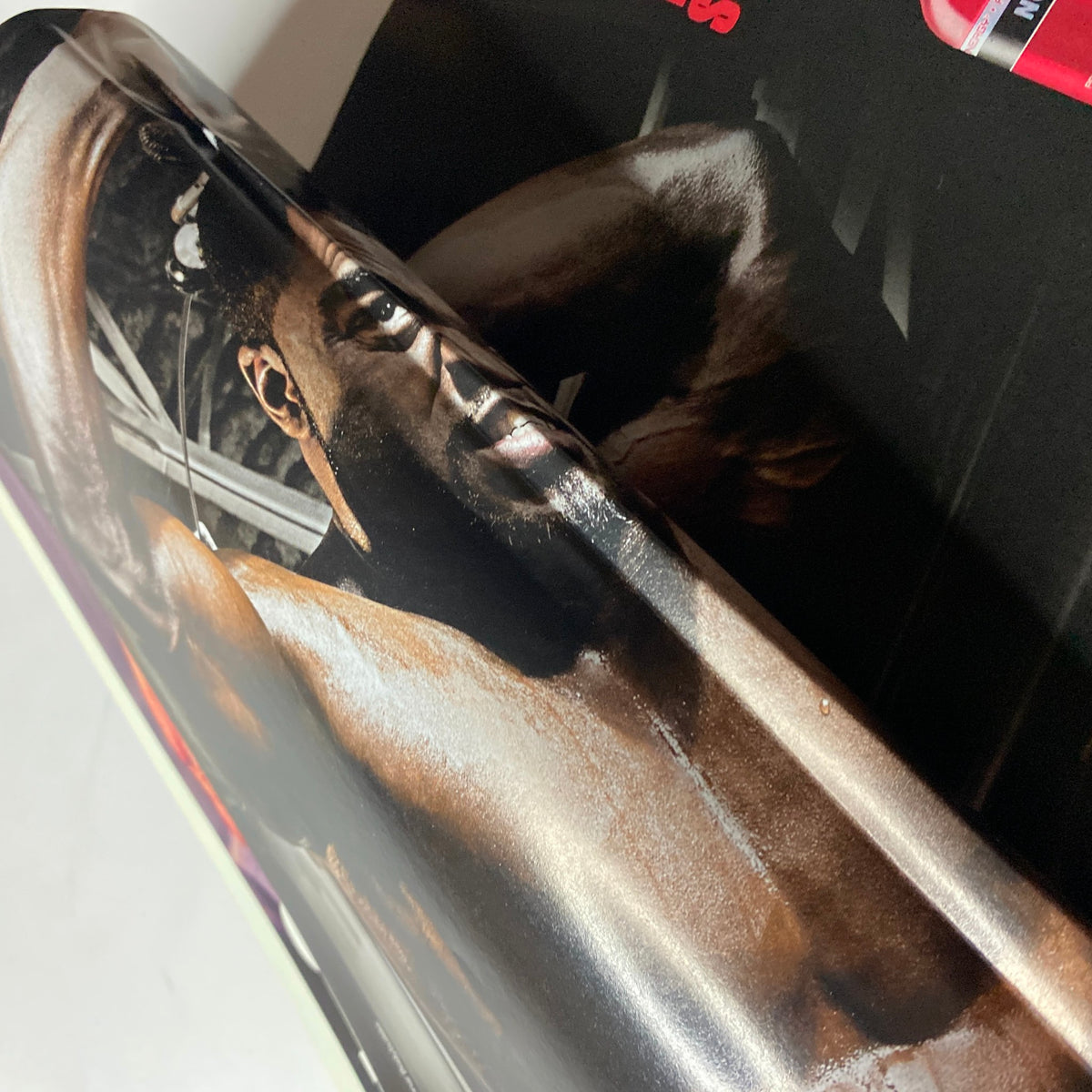 Inside image of MuscleMag International Magazine March 2013 #370 showcasing a muscular athlete posing with visible muscle definition under dramatic lighting.