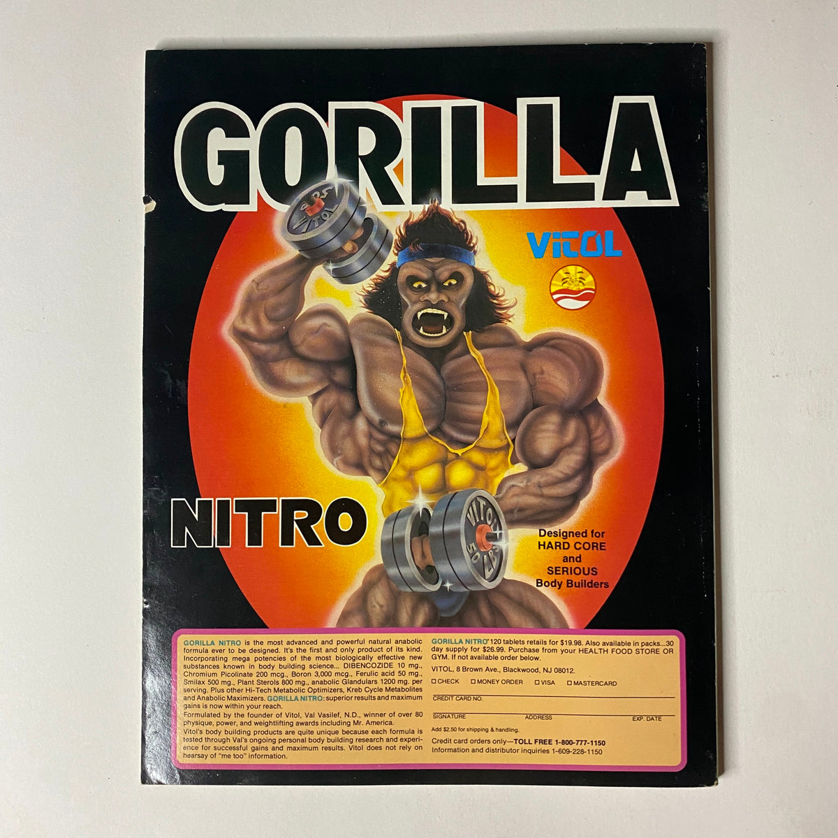 Cover image of Muscular Development Magazine June 1990 featuring a vibrant illustration of a muscular gorilla lifting weights, emphasizing bodybuilding themes. Ideal for vintage fitness enthusiasts, this edition includes Shawn Ray and Laura Creavalle, along with a centerfold poster.