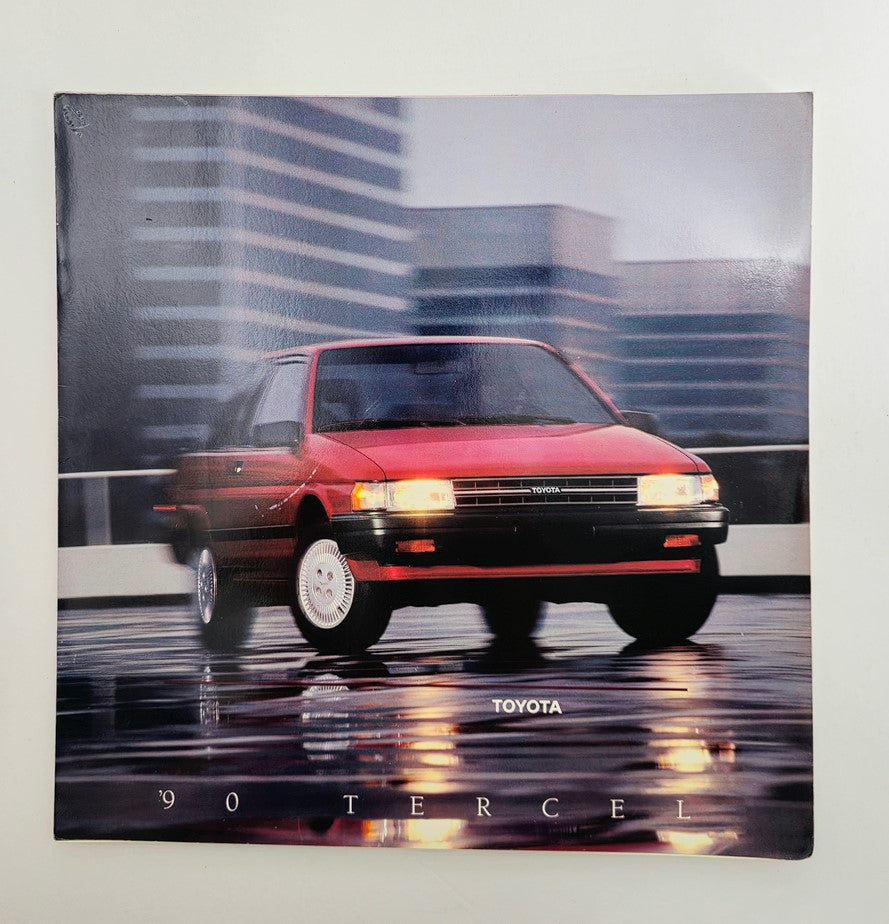 Cover of the 1990 Toyota Tercel Subcompact Car Sale Catalog Brochure showcasing a red Toyota Tercel against a cityscape background. Celebrated for its reliability and compact design, this brochure offers a glimpse into the features and design elements of the Tercel.