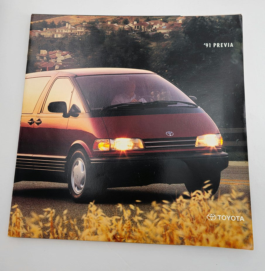 Cover image of the 1991 Toyota Previa 2.4L 2AZ-FE Car Sale Catalog Brochure, showcasing the iconic minivan against a scenic backdrop, highlighting its design and features.