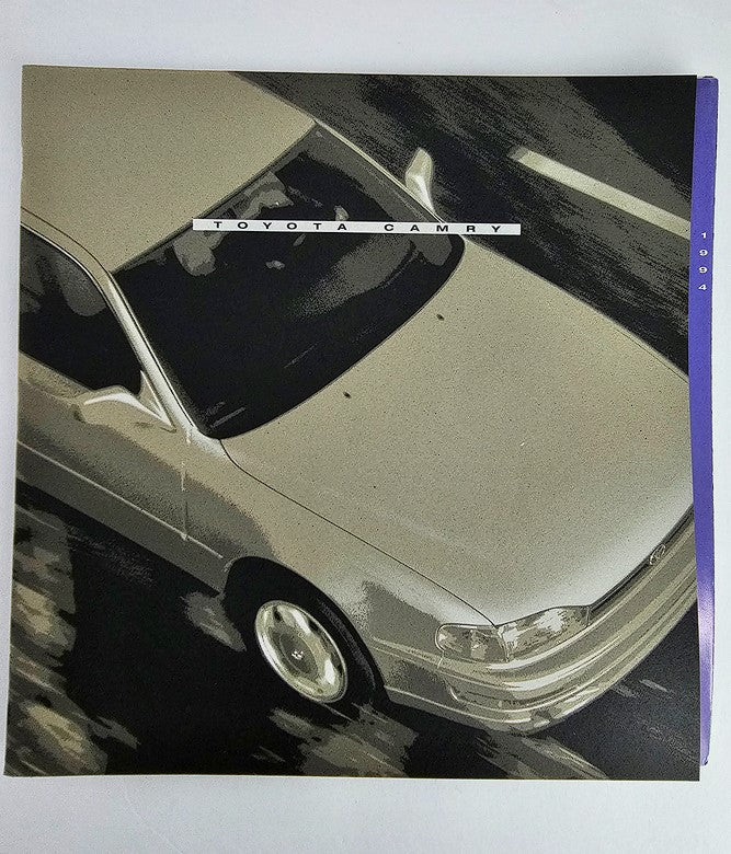 1984 Toyota Camry XV10 CS Coupe Version Car Sale Brochure, showcasing the sleek design and exterior features of the vehicle from an aerial perspective.