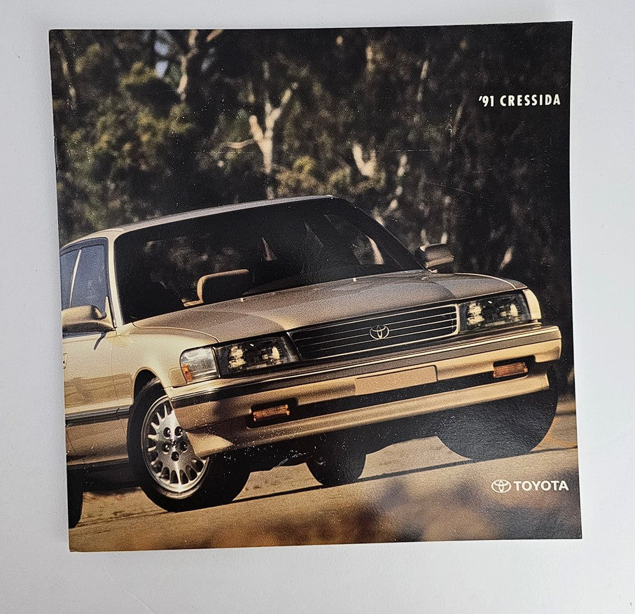 1991 Toyota Cressida 7M-GE Engine Car Sale Brochure Catalog featuring a stylish image of the Cressida in a natural setting, showcasing its distinctive design and iconic features.