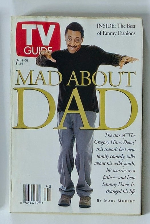 TV Guide Magazine from October 4, 1997 featuring Gregory Hines on the cover with the title 'Mad About Dad'. The magazine highlights the star of 'The Gregory Hines Show' and includes insights into his family comedy, along with fashion features from the Emmy Awards.