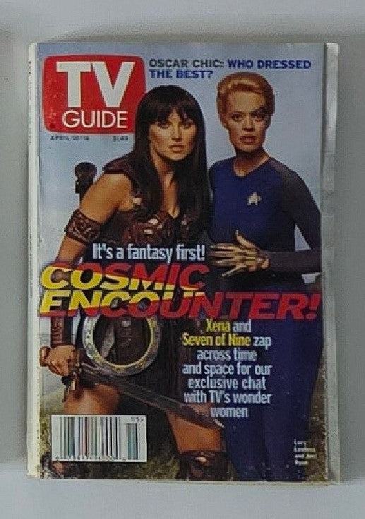 Cover of TV Guide Magazine April 10 1999 featuring Lucy Lawless as Xena and Jeri Ryan as Seven of Nine, showcasing a cosmic theme with the headline 'It's a fantasy first! COSMIC ENCOUNTER!'